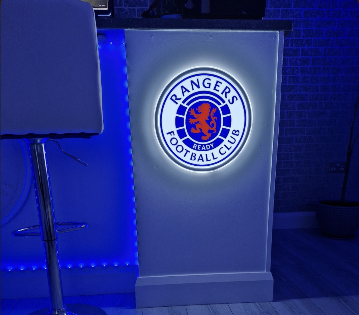 Rangers LED panel lit up in a home bar setup